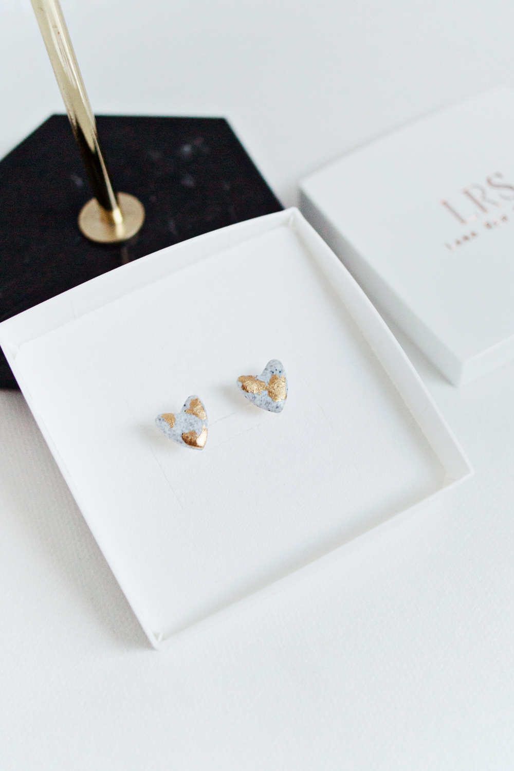 Hexagonal stud earrings in a granite style with gold leaf